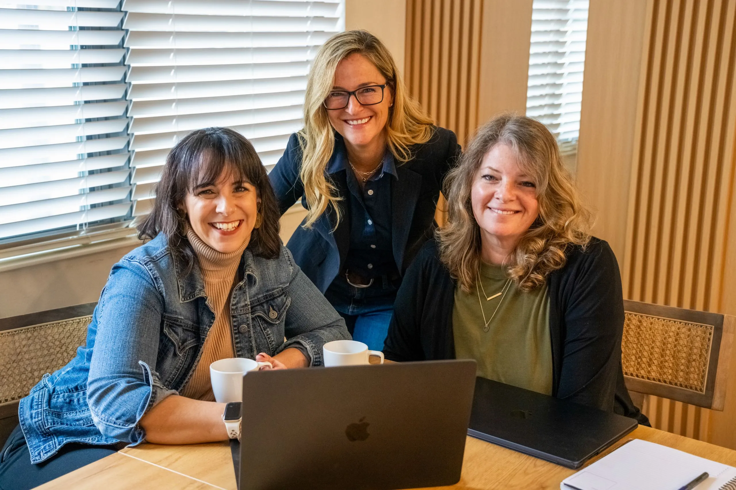 The Envision Promotions team working together in the office